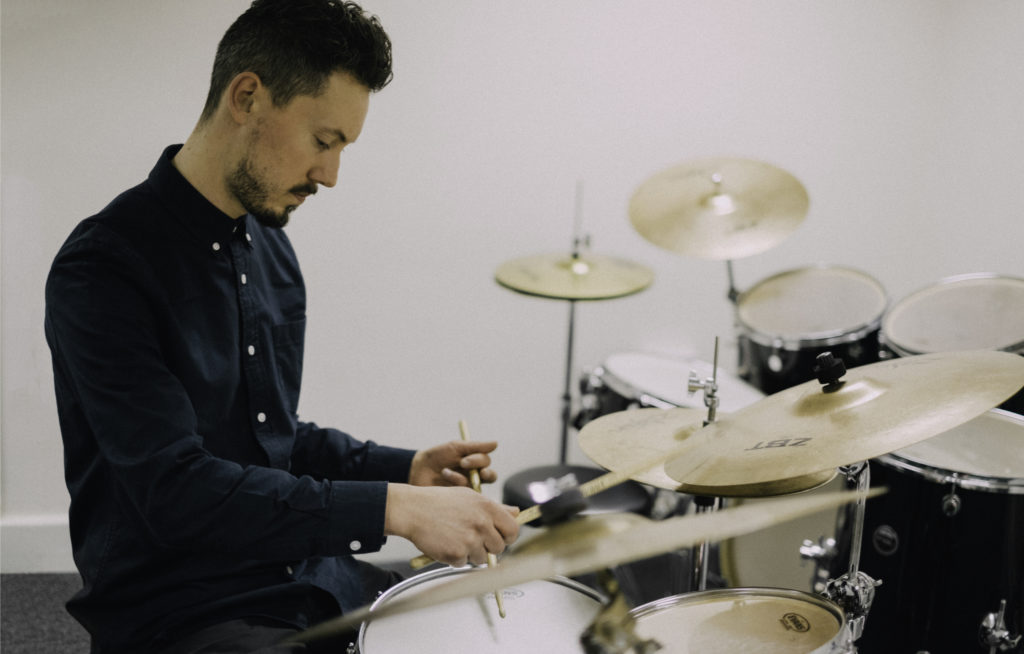 A picture of Euan Rodger - a teacher at Dye House Drum Works - playing drums!