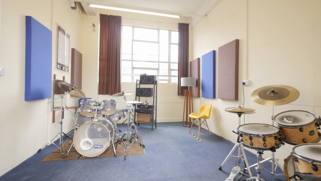 Tuition room 1 at Dye House Drum Works drum school, with 2 drum sets placed in a spacious and acoustically treated room. 